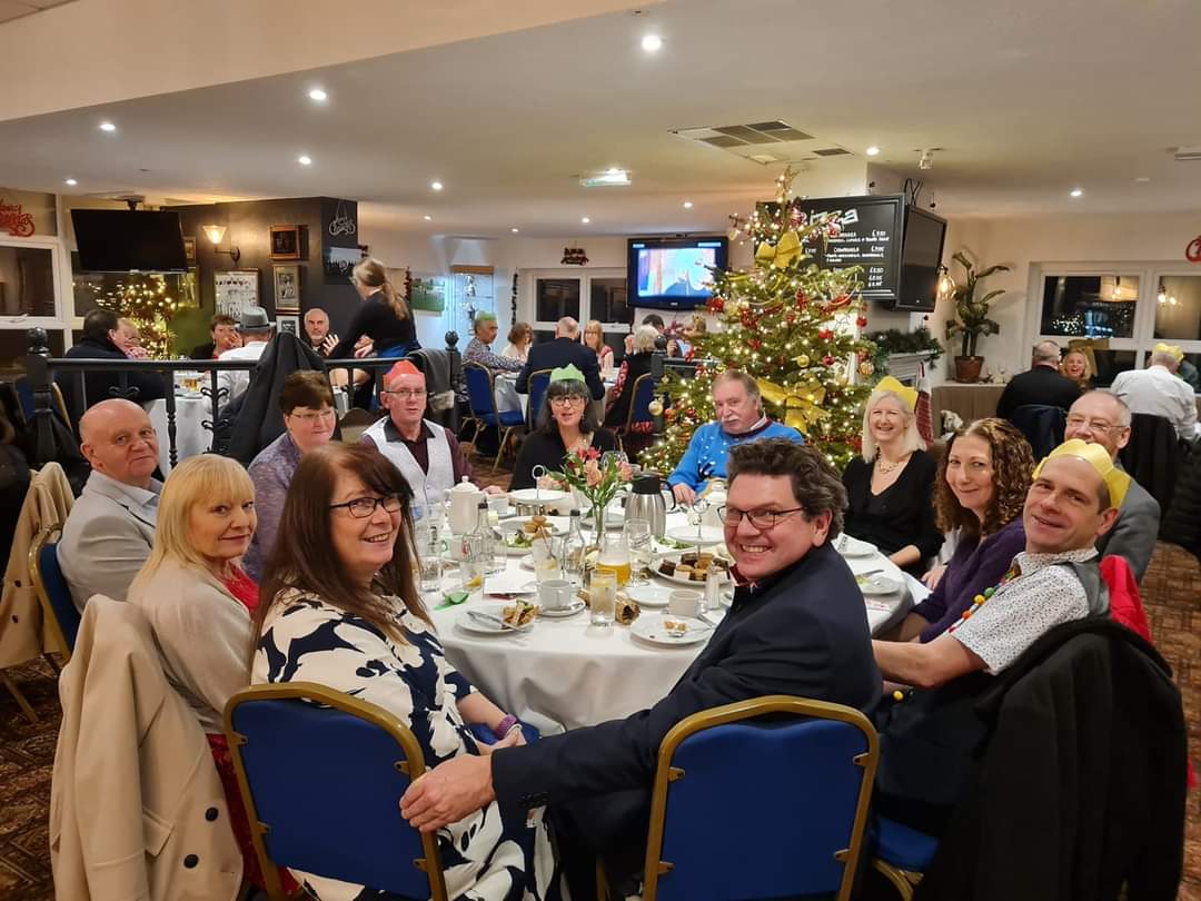 Dancers sitting down for  afternoon tea